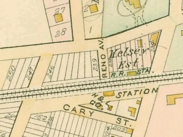 The image shows an old map of a city with a lot of buildings, numbers, and text. It appears to be a...