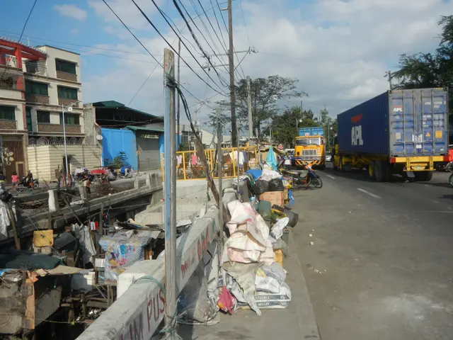 The image shows a city street filled with lots of trash on the side of it. There are vehicles on...