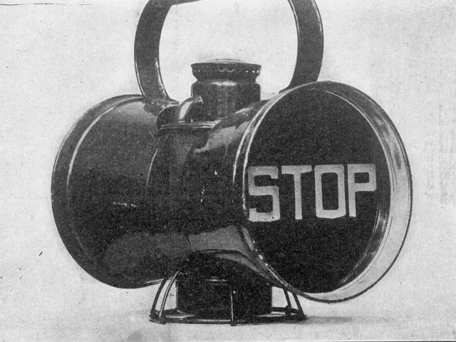 The image shows a black and white photo of a horn with the word "STOP" written on it.
