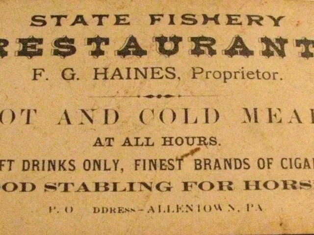 The image shows an old business card for a state fishery restaurant on a table. The card has text...
