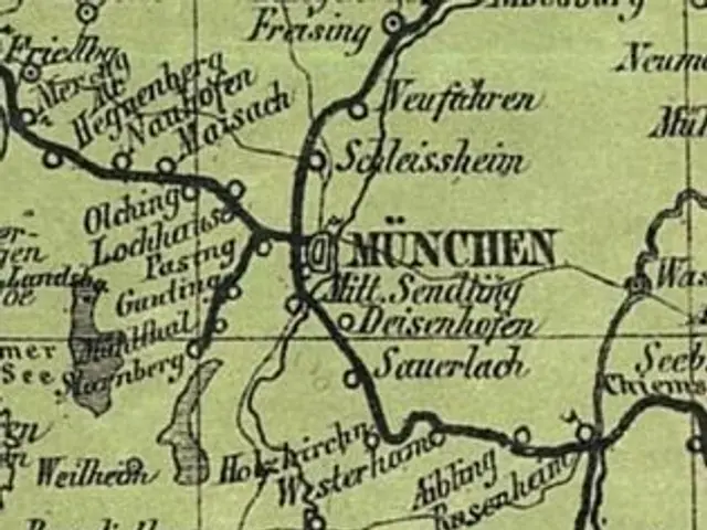 The image shows an old map of the city of Munich, Germany, with text written on it. The map is...