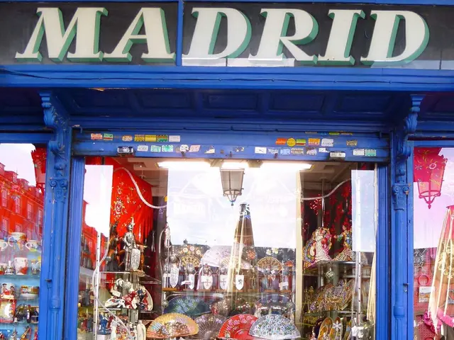 The image shows a store front with a blue door and a sign that reads "Madrid". Inside the store,...