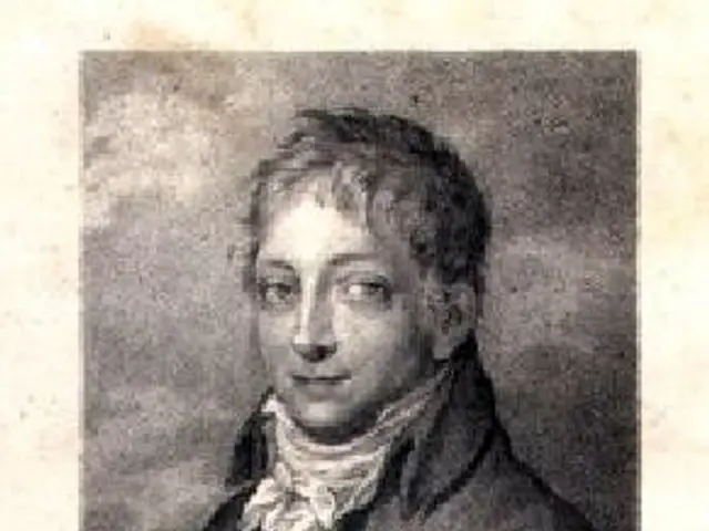 The image shows a black and white portrait of Hans von Thummel, a German composer, wearing a coat....