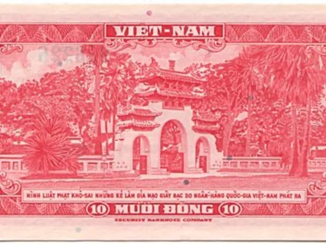 The image shows a red Vietnam 10 Dong banknote with a picture of a building and trees on it. The...
