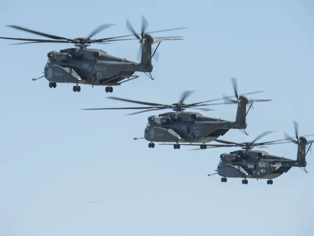 The image shows three military helicopters flying in formation in the sky, with something written...