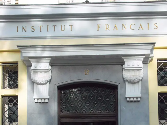 The image shows the entrance to the Institut Français in Paris, France. It is a building with...