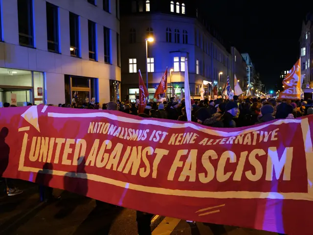 The image shows a group of people walking down a street, holding a banner that reads "United...