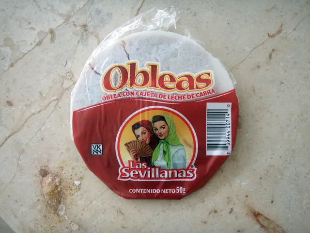 The image shows a bag of cheese sitting on top of a counter, with a label on the cover featuring...