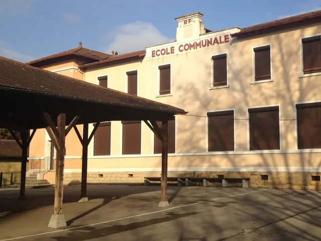 The image shows a building with a sign that reads "Ecole Communale" in front of it, surrounded by a...