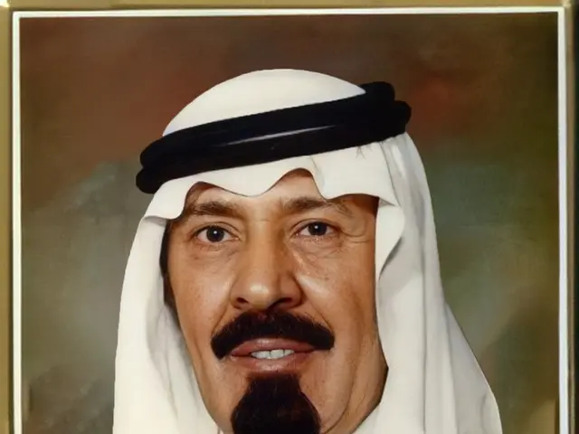 The image shows a photo frame of Sheikh Mohammed bin Rashid Al Maktoum, the King of Saudi Arabia....