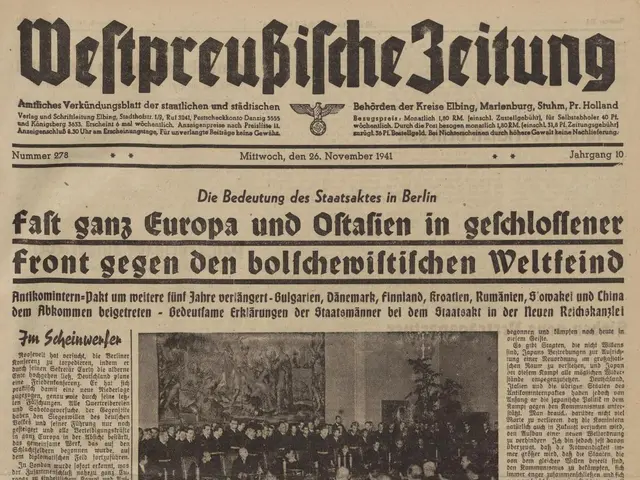 The image shows the front page of a newspaper with a picture of a group of people on it. The...