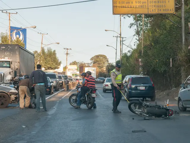 The image shows a group of people standing around a motorcycle that has been involved in a crash on...