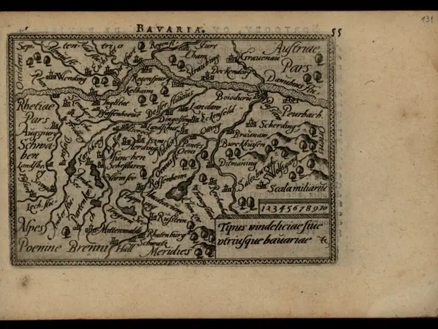 The image shows an old book with a map of Bavaria on it, set against a black background. The map is...
