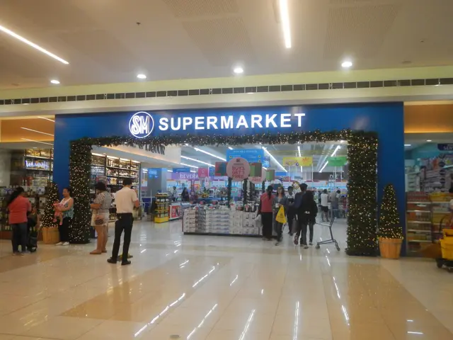 The image shows a group of people standing in front of a supermarket, with some of them holding...
