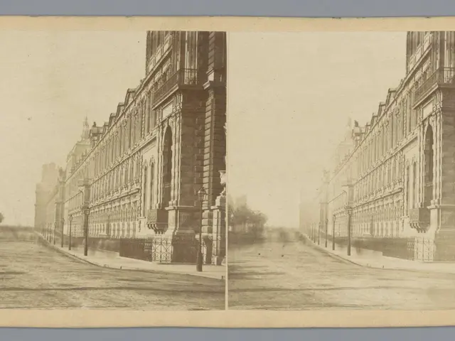 The image shows a black and white photo of a city street with buildings, street poles, street...