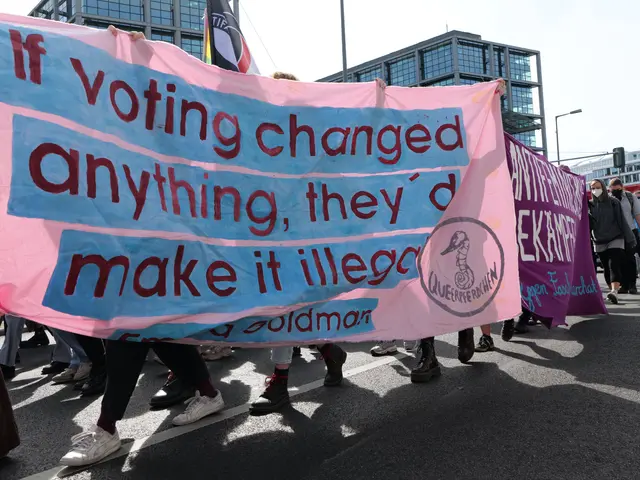 The image shows a group of people walking down a street, holding a banner that reads "If voting...