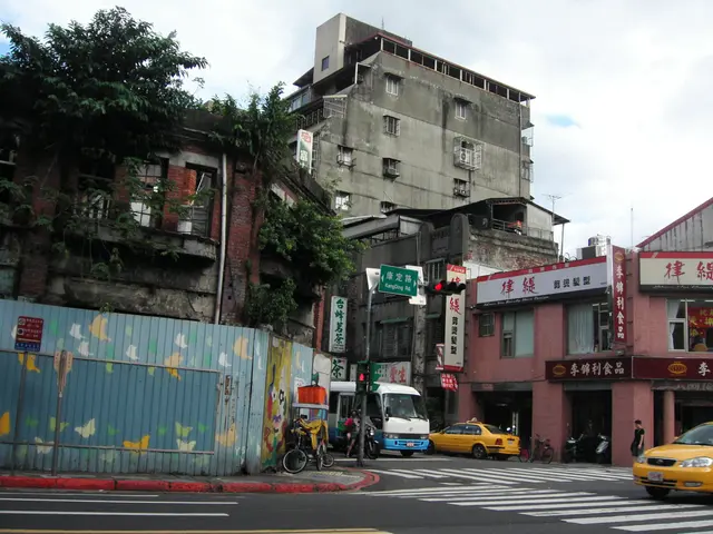 The image shows a city street with a yellow taxi cab driving down it, surrounded by tall buildings...
