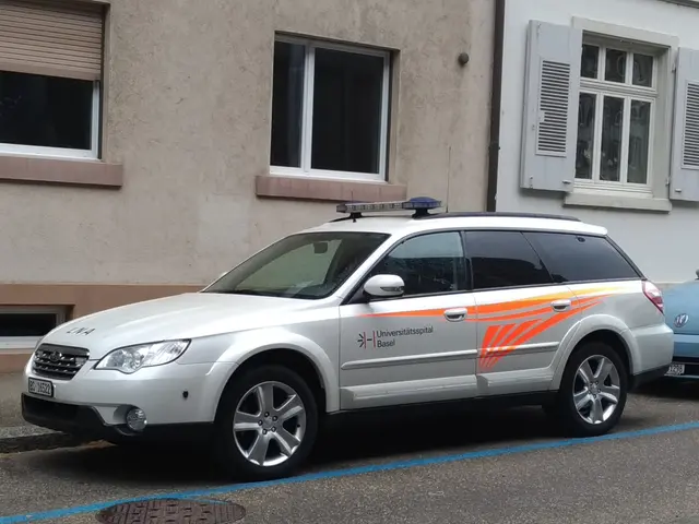 The image shows a police car parked in front of a building with windows and shutters. The car is on...