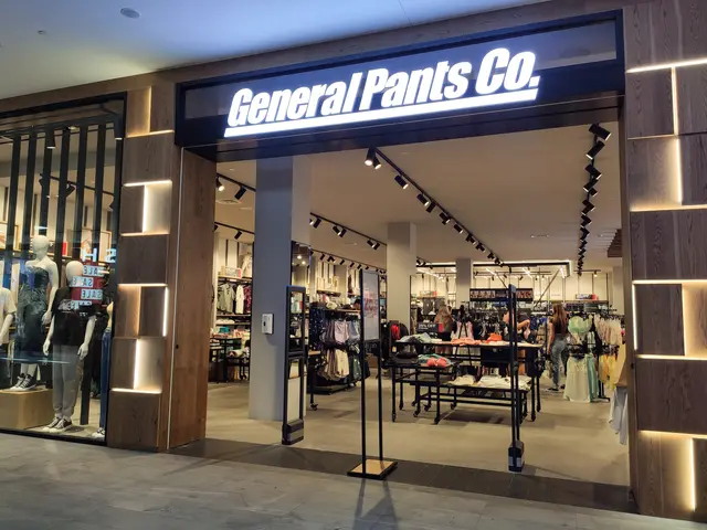 The image shows a general pants co store in a shopping mall, with mannequins wearing dresses,...