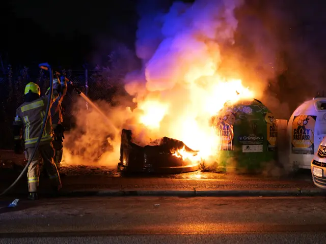 The image shows a firefighter wearing a helmet and holding a pipe in his hand, standing in front of...