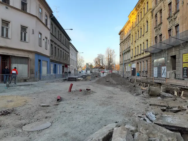 The image shows a city street with a lot of rubble on the ground, including stones, pipes, and...
