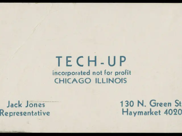 The image shows an old business card with the words "tech-up incorporated not for profit" written...