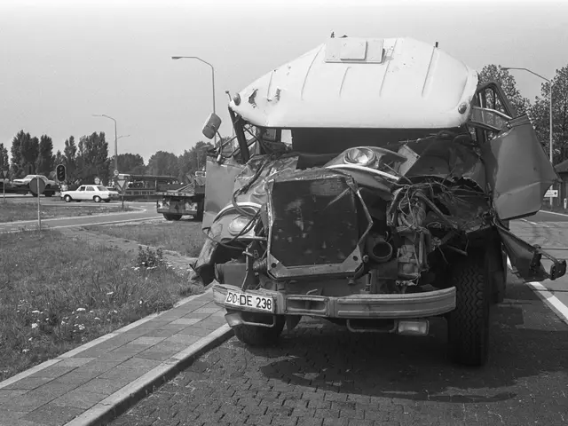 The image shows a black and white photo of a car that has been involved in a crash on the side of...