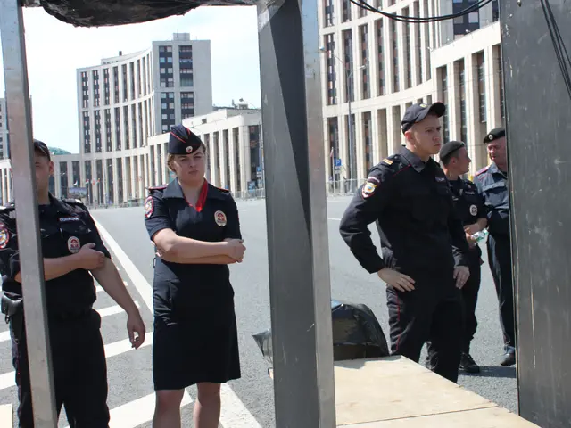 The image shows a group of police officers standing next to each other on a street. They are...