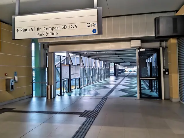 The image shows a long hallway with a sign on the wall that reads "Park & Ride". There is a trash...