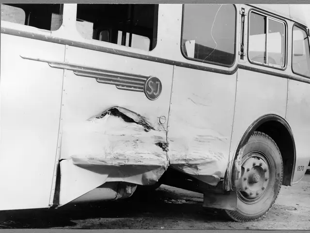 The image shows a black and white photo of a bus that has been involved in a crash on the side of...