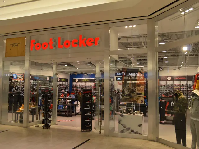 The image shows a Foot Locker store in a shopping mall, with glass walls and doors, mannequins...