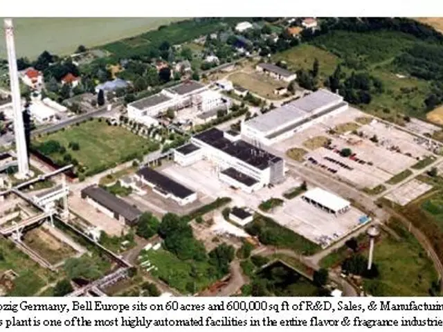 The image shows an aerial view of a large industrial area with buildings, trees, plants, grass,...