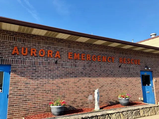 The image shows the Aurora Emergency Rescue building in Aurora, Colorado. It is a brick building...