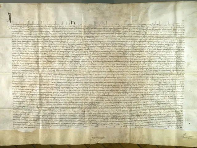 The image shows a large piece of paper on display in a museum, with text written on it and a wall...