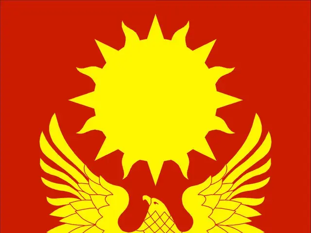 The image shows the flag of Kyrgyzstan, which is composed of a red background with a yellow sun in...