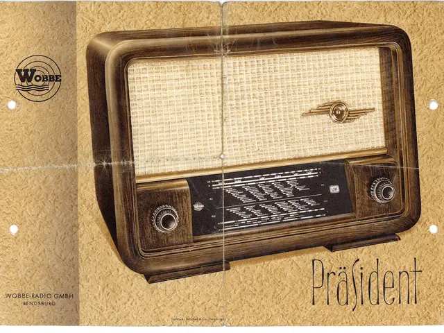 The image shows an old fashioned radio sitting on top of a piece of paper with text and a logo on...