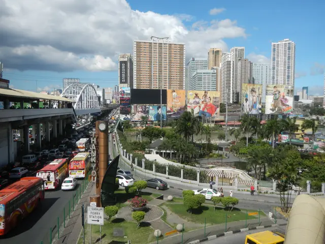 The image shows a bustling city street filled with lots of traffic, including buses, cars, and...