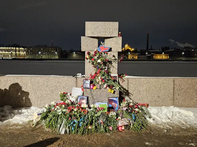 The image shows a memorial to the victims of the Chernobyl disaster in Ukraine, with flower...