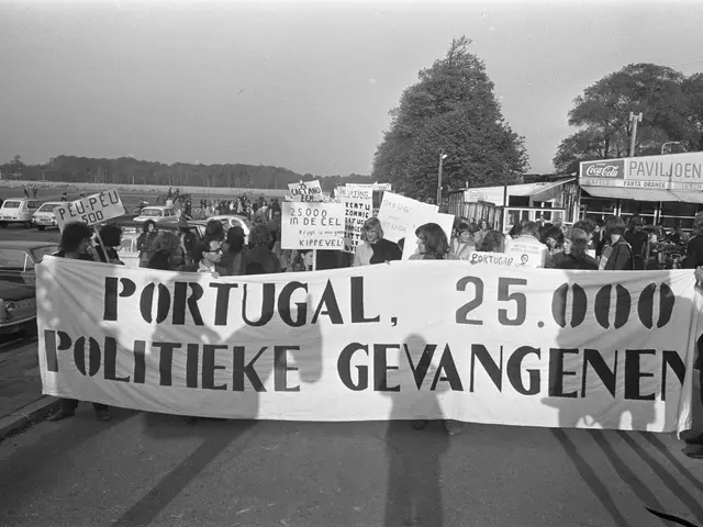 The image shows a group of people standing on the road, holding a banner that reads "Portugal...