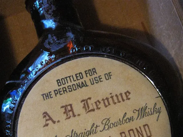 The image shows a bottle of A.H. Levine Kentucky Straight Bourbon Whiskey sitting atop a wooden...