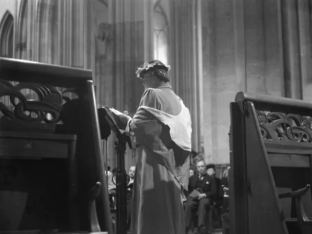 The image shows a woman standing in front of a pulpit in a church, surrounded by a group of people...