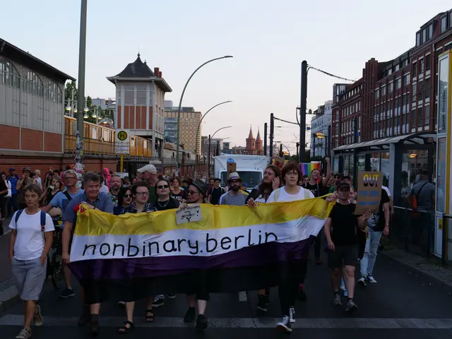 The image shows a group of people walking down a street in Berlin, holding a banner that reads...