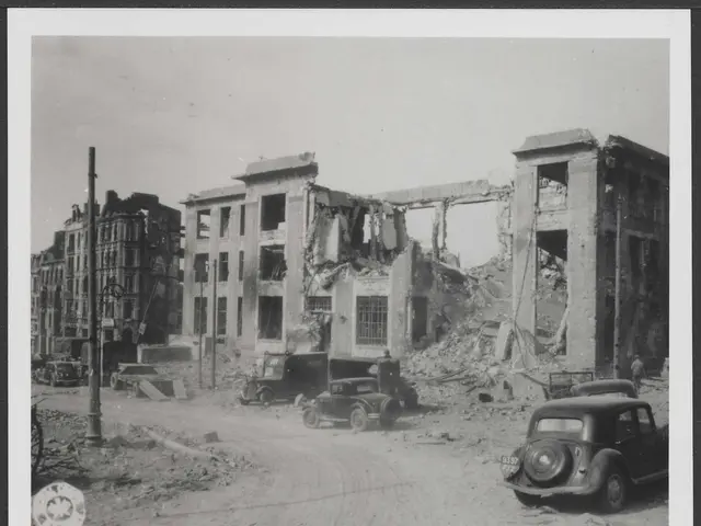 The image shows a black and white photo of a city street with cars parked in front of a building...
