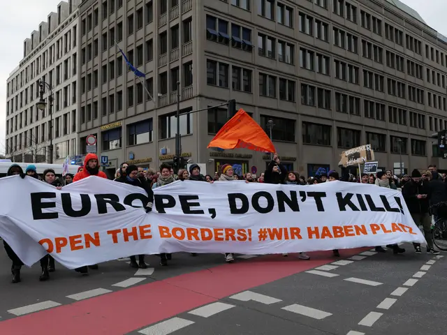 The image shows a group of people walking down a street, holding a banner that reads "Europe, Don't...