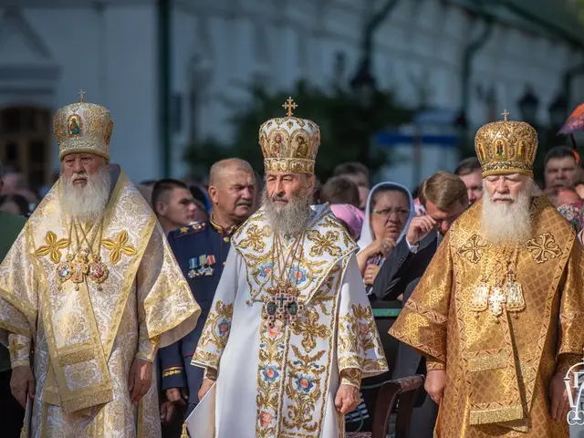 The image shows a group of priests standing next to each other in front of a crowd, wearing crowns...