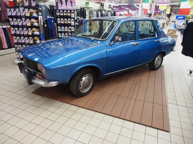 The image shows a blue car parked inside of a store, surrounded by clothes hung on hangers,...