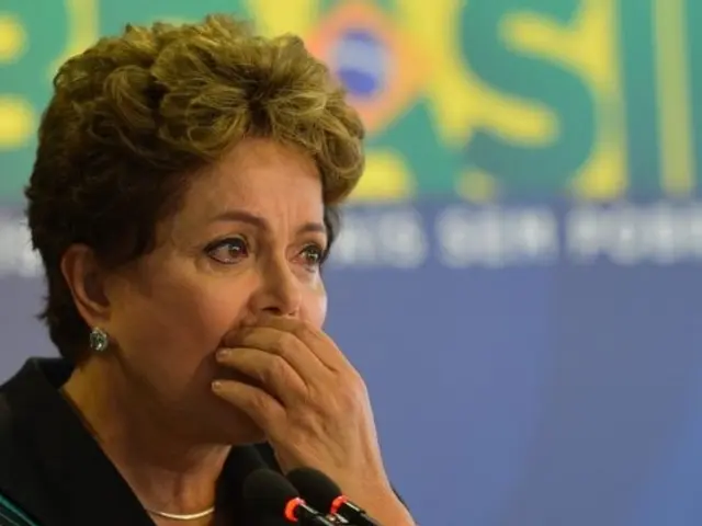 The image shows Brazil's President Dilma Rousseff speaking during a news conference in Rio de...