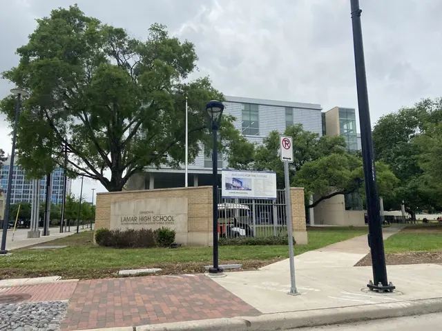 The image shows a large building with a sign in front of it, surrounded by street poles, street...