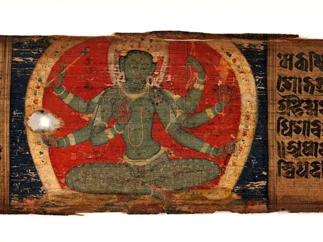 The image shows a painting of a Buddhist deity on a piece of paper with text written on it. The...