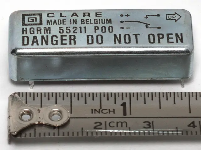 The image shows a metal box with the words "Danger Do Not Open" written on it, sitting next to a...